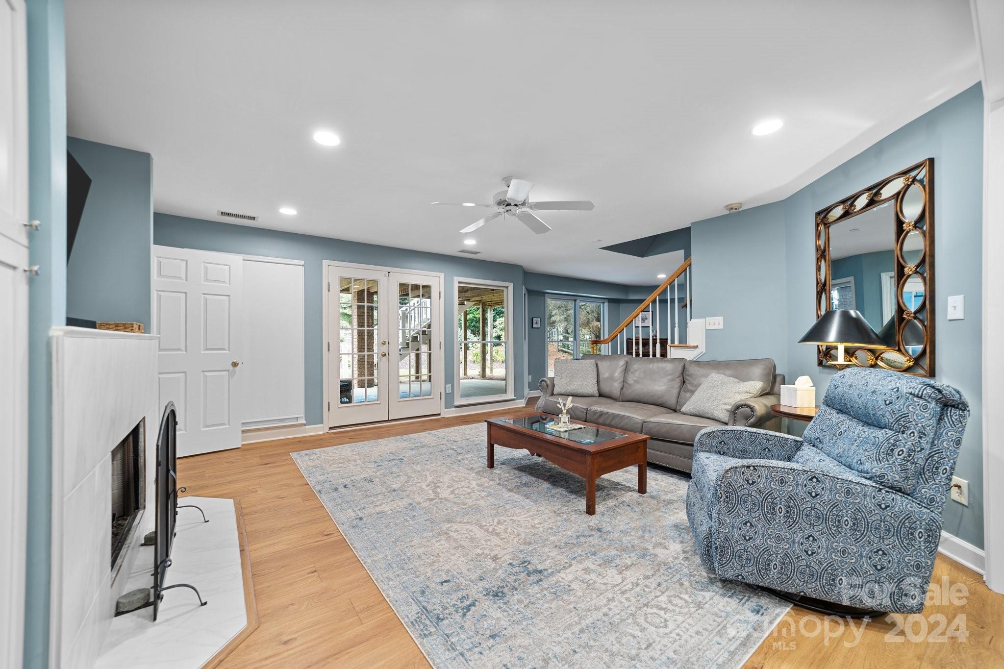 251 Kimberly Road Davidson, NC 28036 - Photo 35 of 47 a living room with fireplace furniture and a rug