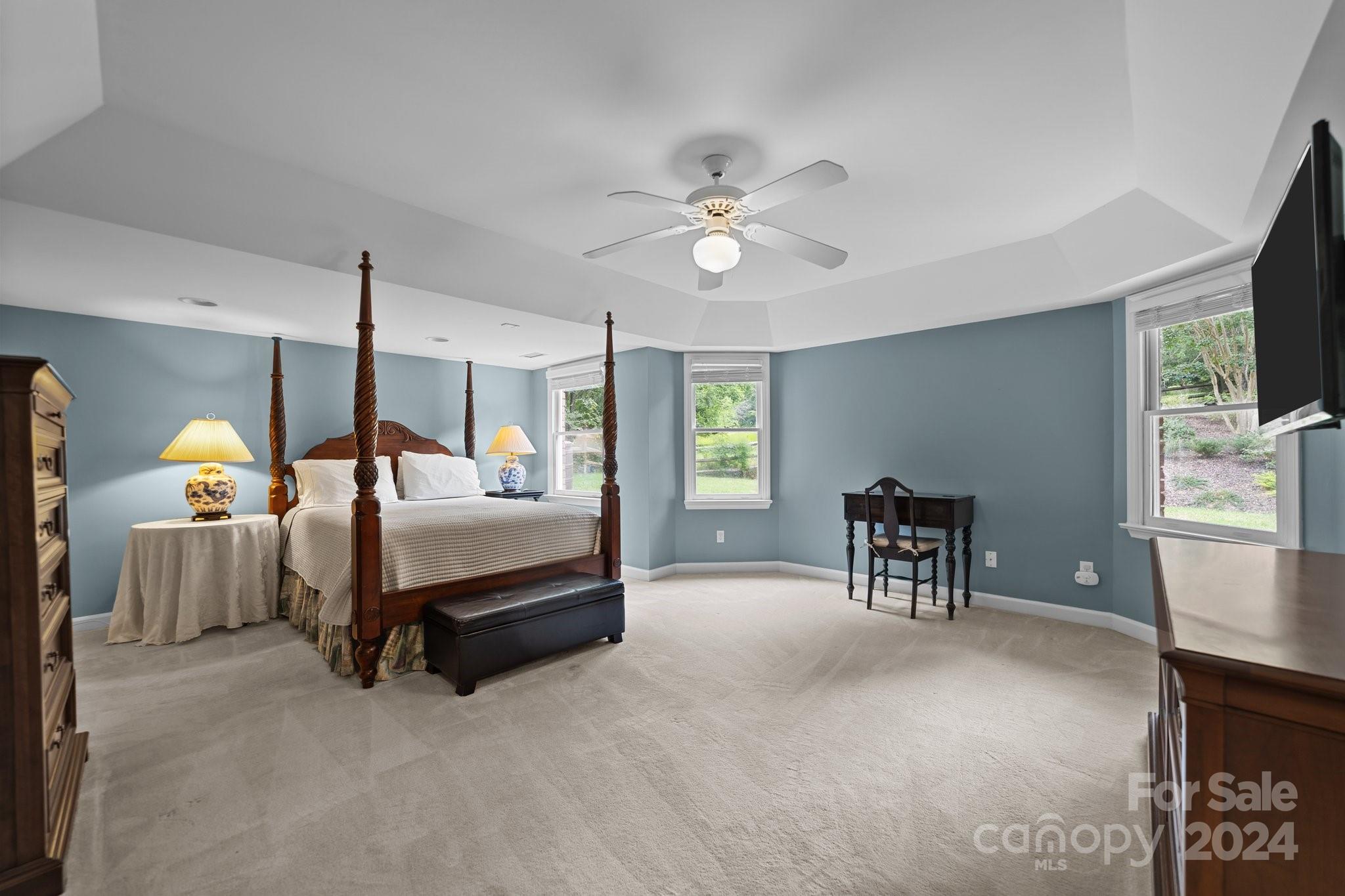 251 Kimberly Road Davidson, NC 28036 - Photo 39 of 47 a bedroom with a bed and a chandelier