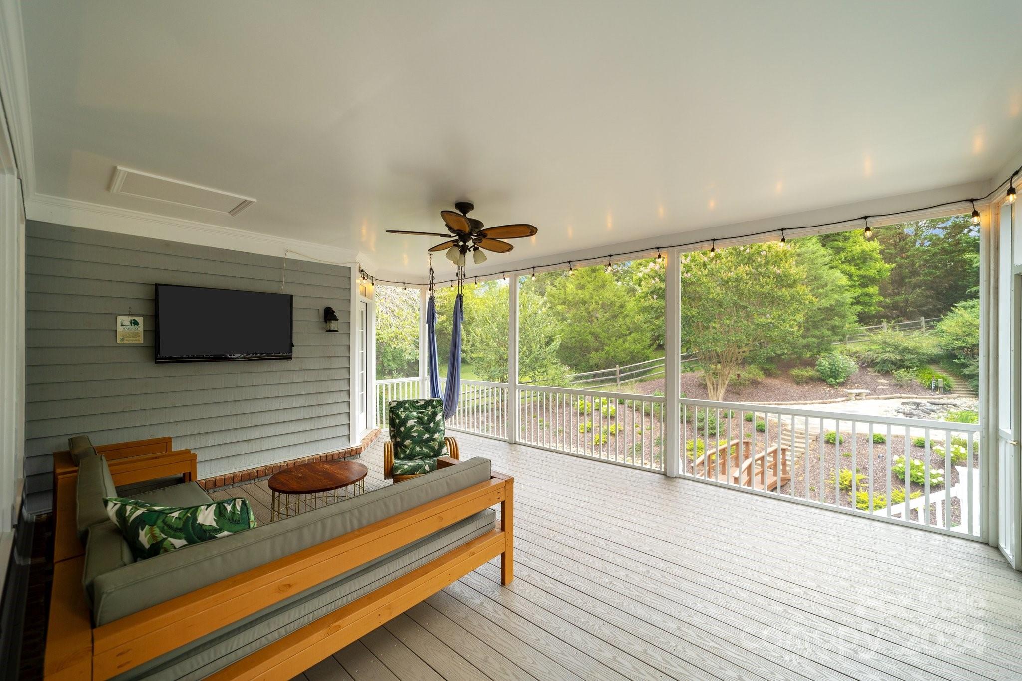 251 Kimberly Road Davidson, NC 28036 - Photo 41 of 47 a living room with furniture floor to ceiling window and wooden floor