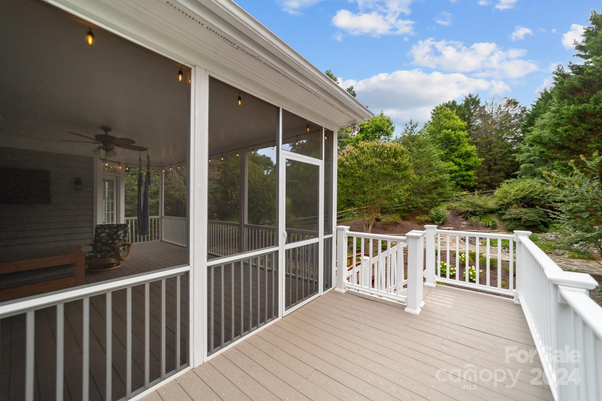 251 Kimberly Road Davidson, NC 28036 - Photo 43 of 47 a view of a wooden deck and a floor to ceiling window