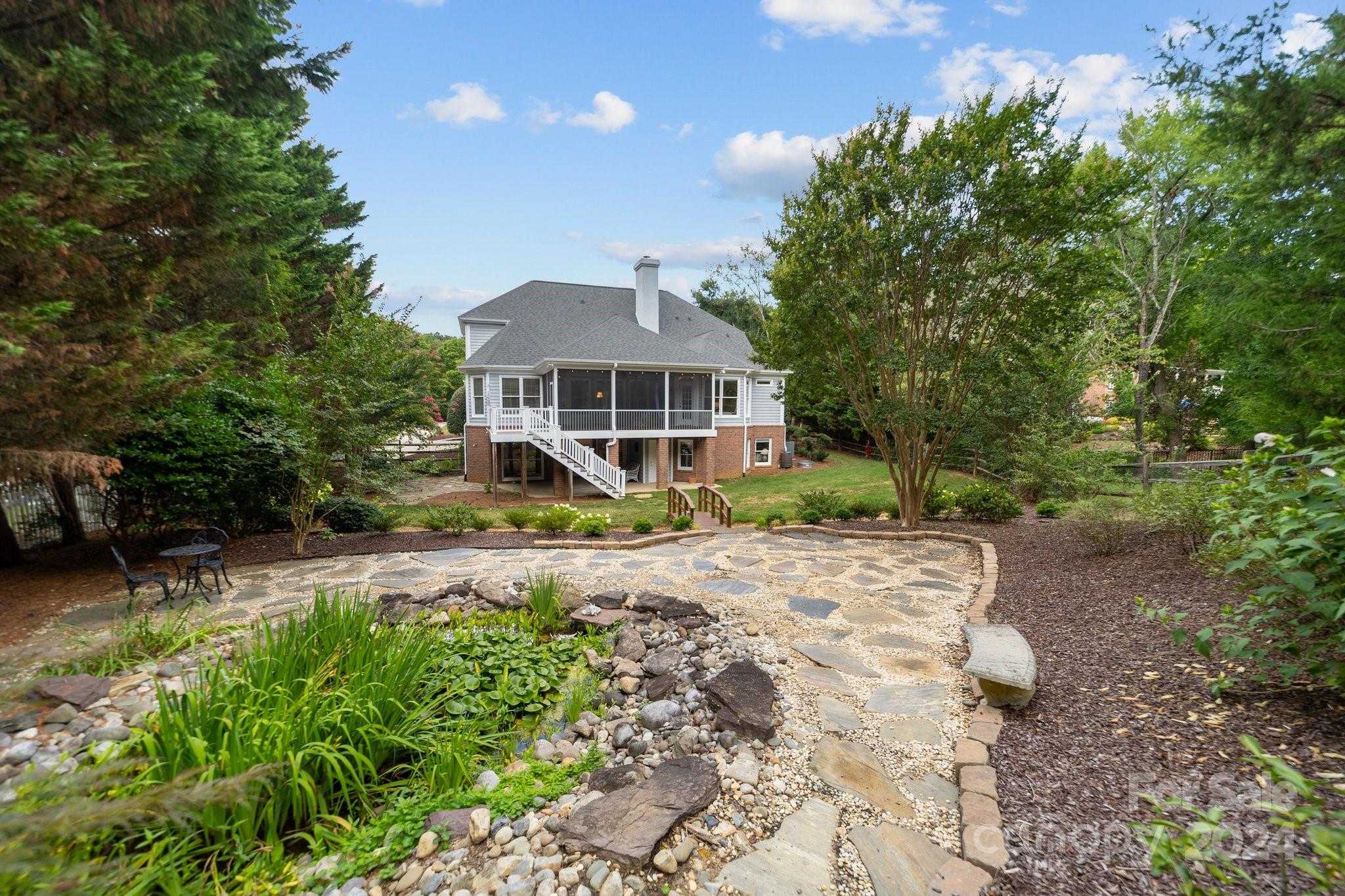 251 Kimberly Road Davidson, NC 28036 - Photo 44 of 47 a front view of a house with a garden