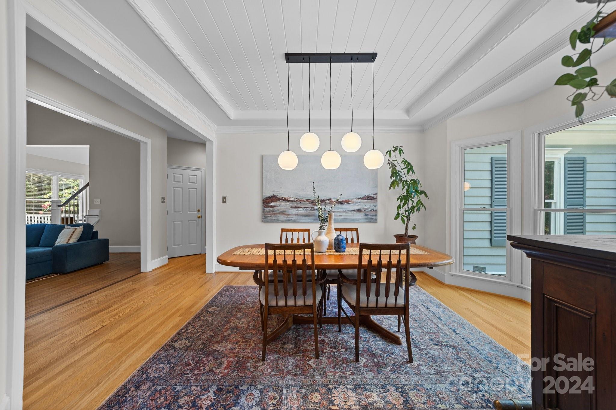 251 Kimberly Road Davidson, NC 28036 - Photo 10 of 47 a view of a dining room with furniture and wooden floor