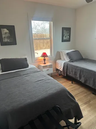 a bedroom with a bed and a couch