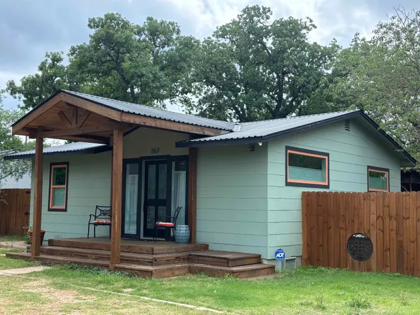 a backyard of a house with seating space