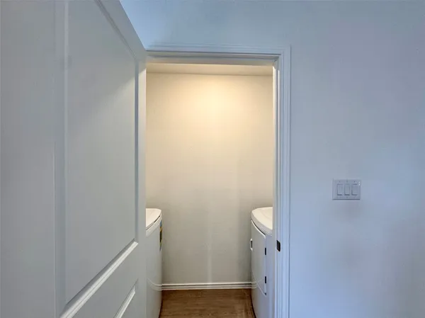 a bathroom with a granite countertop shower and a toilet