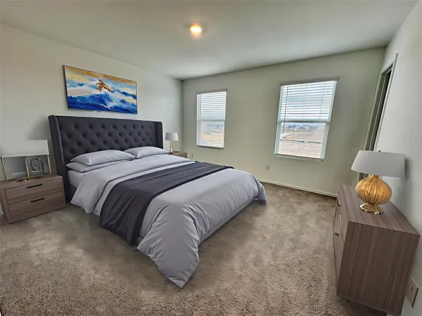 a bedroom with a bed and window