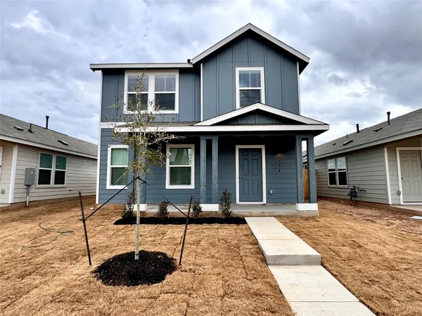 a front view of a house with yard