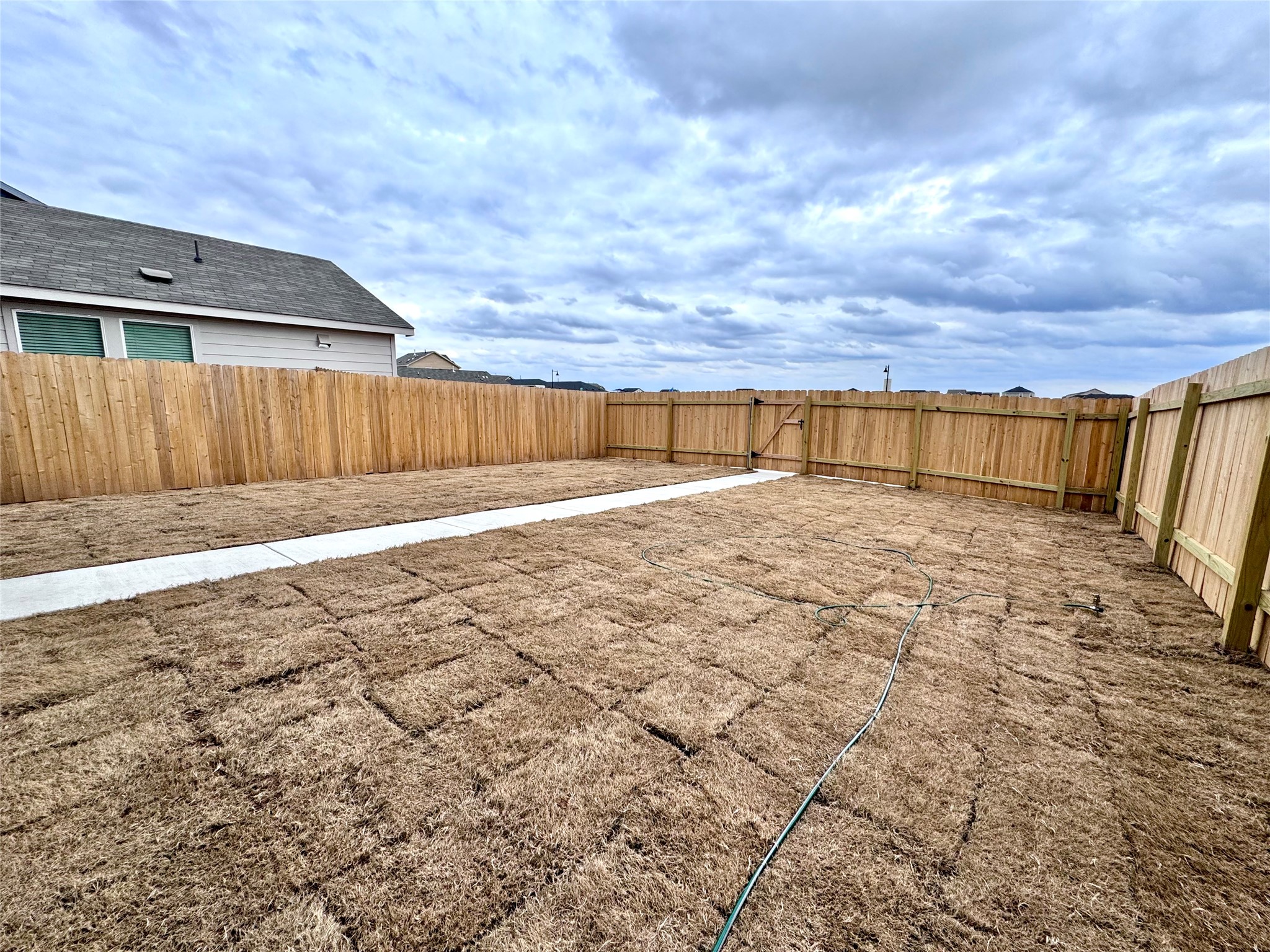 554 Sormonne Loop Kyle, TX 78640 - Photo 34 of 35 View of fenced backyard