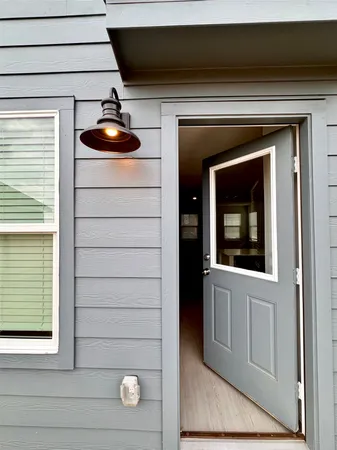 a front view of a house with a yard table and chairs