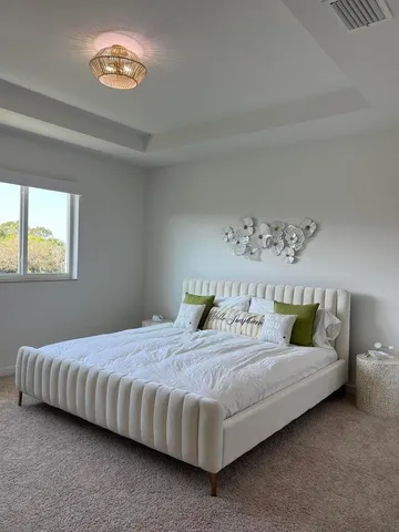 a bedroom with a bed and a table