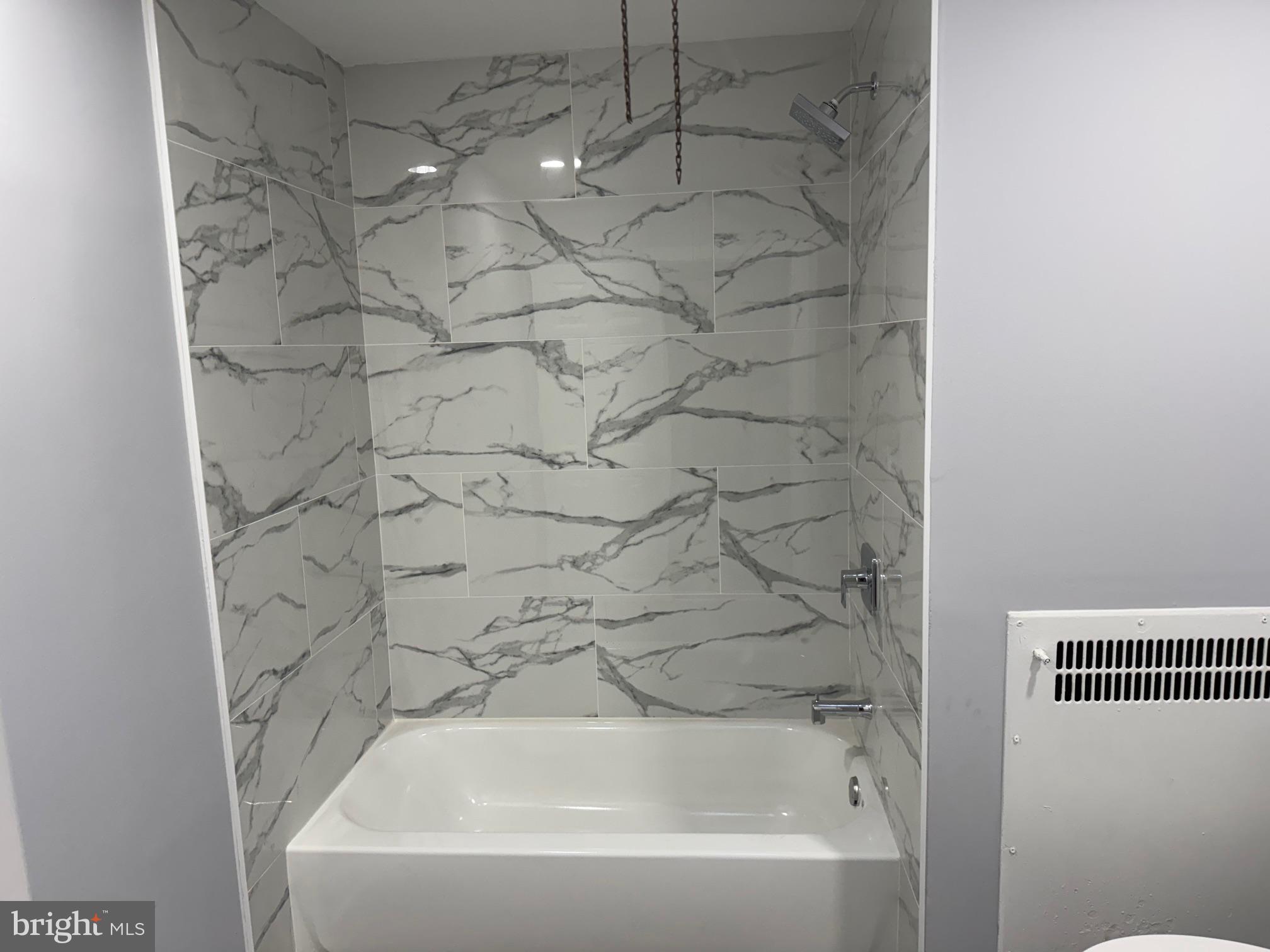 126 Richfield Road Upper Darby, PA 19082 - Photo 11 of 21 a bathroom with a bathtub