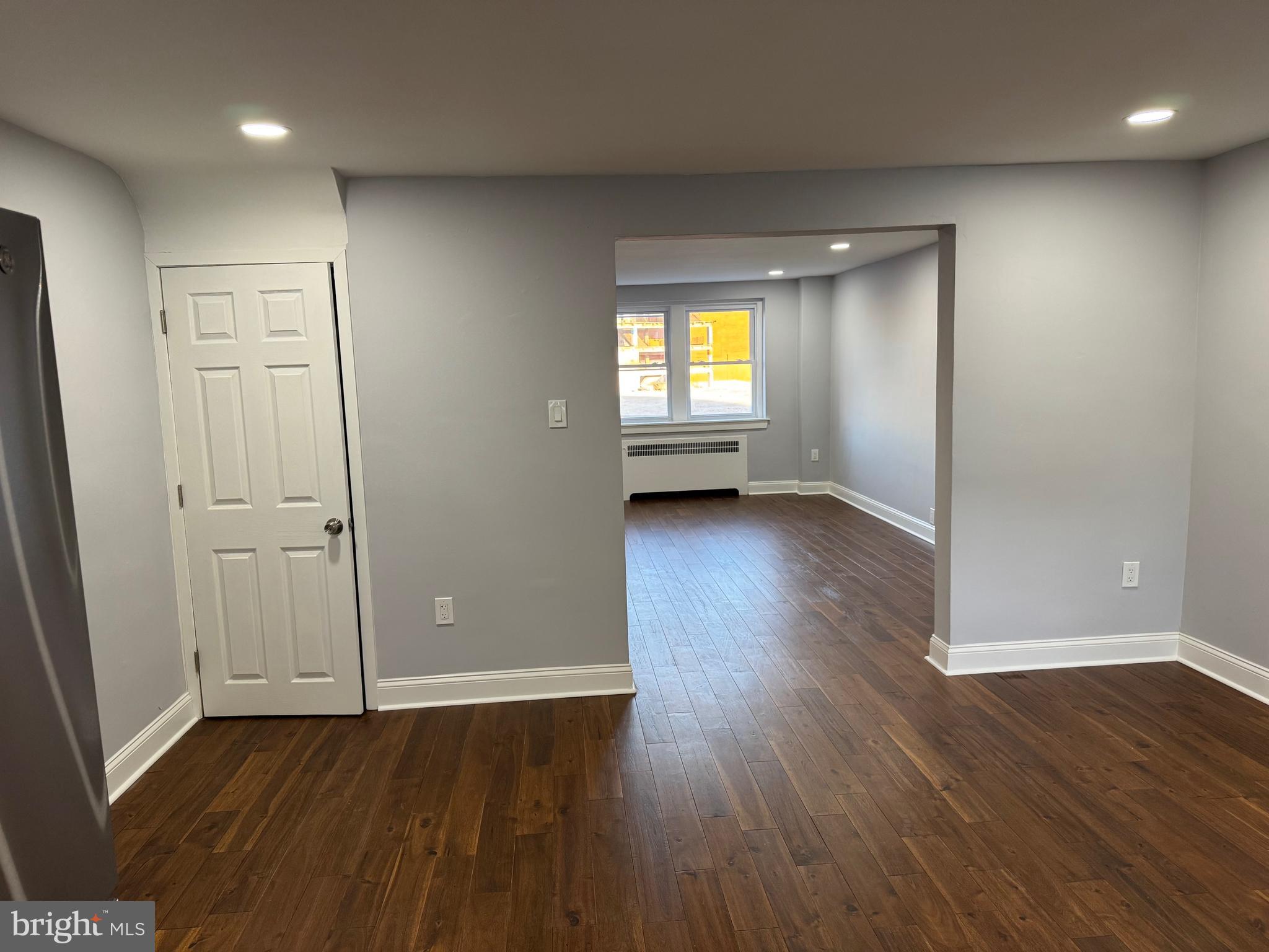 126 Richfield Road Upper Darby, PA 19082 - Photo 14 of 21 an empty room with wooden floor and windows