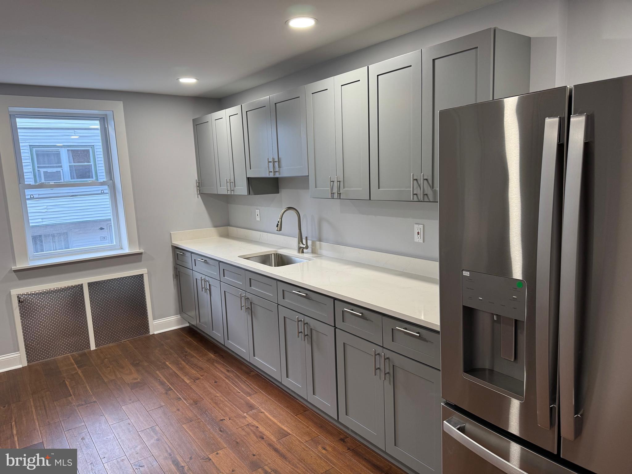 126 Richfield Road Upper Darby, PA 19082 - Photo 6 of 21 a kitchen with stainless steel appliances granite countertop a refrigerator sink and cabinets