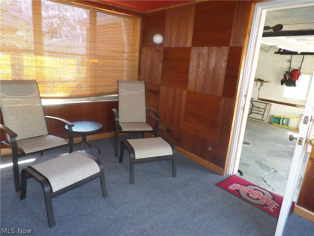 1566 Felton Road South Euclid, OH 44121 - Photo 8 of 21 The enclosed porch that connects the garage and the kitchen has brand new indoor/outdoor carpet.