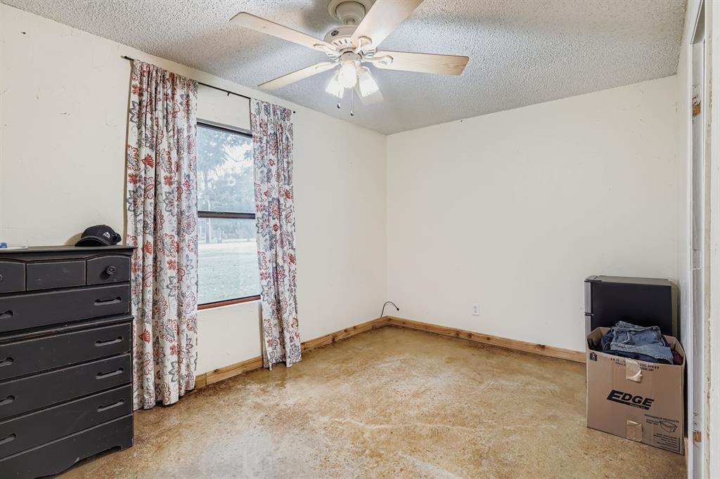 1305 Hutchins Lane Springtown, TX 76082 - Photo 11 of 23 wooden floor in an empty room