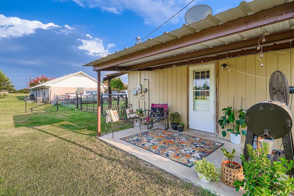 1305 Hutchins Lane Springtown, TX 76082 - Photo 14 of 23 a front view of a house with garden