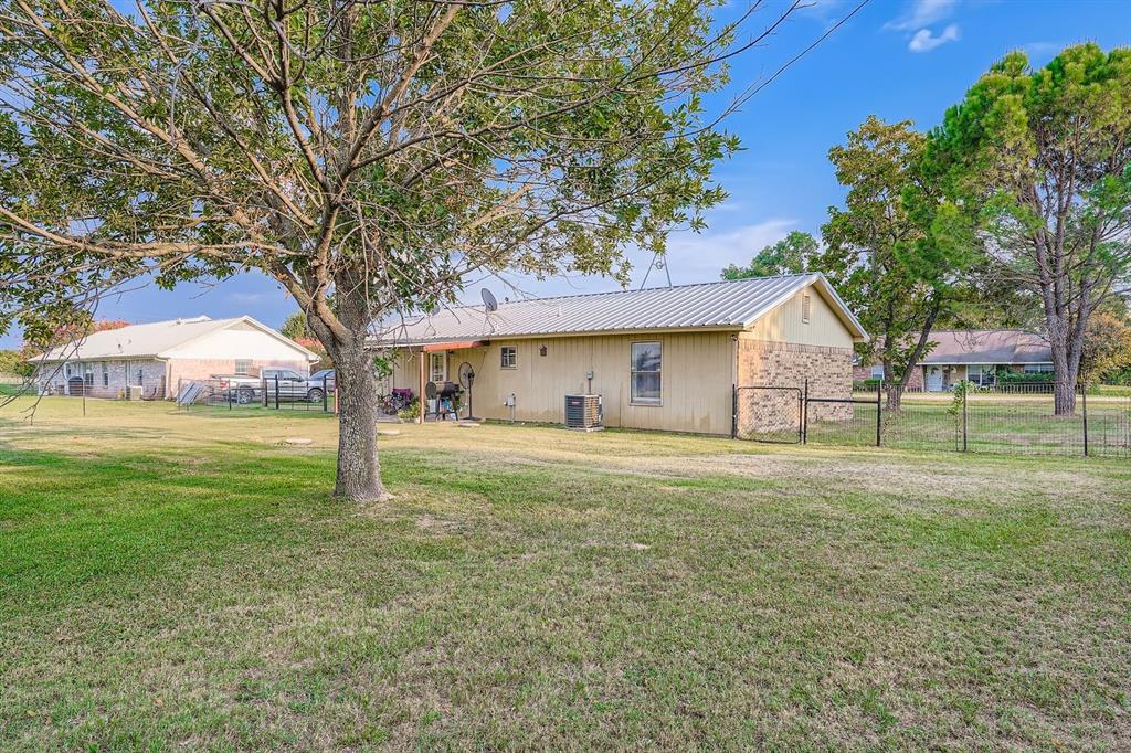 1305 Hutchins Lane Springtown, TX 76082 - Photo 16 of 23 a view of a house with a yard
