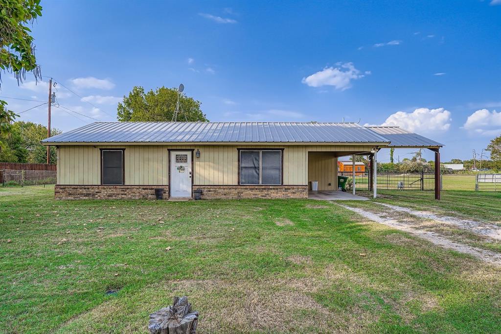 1305 Hutchins Lane Springtown, TX 76082 - Photo 2 of 23 a view of a house with a backyard