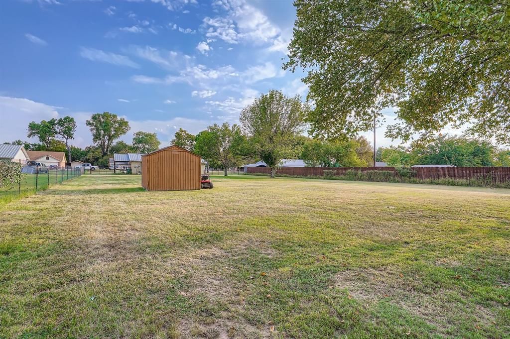1305 Hutchins Lane Springtown, TX 76082 - Photo 21 of 23 a view of a field with an outdoor space and seating