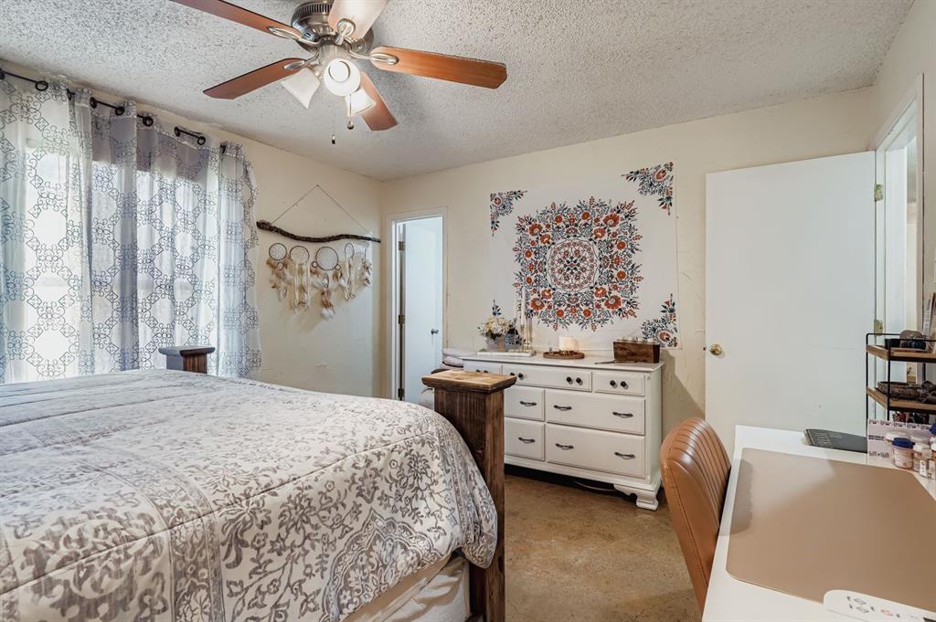 1305 Hutchins Lane Springtown, TX 76082 - Photo 9 of 23 a bedroom with a bed and a window