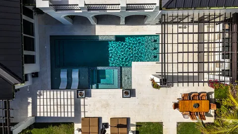 a bathroom with a sink a light fixture and a mirror