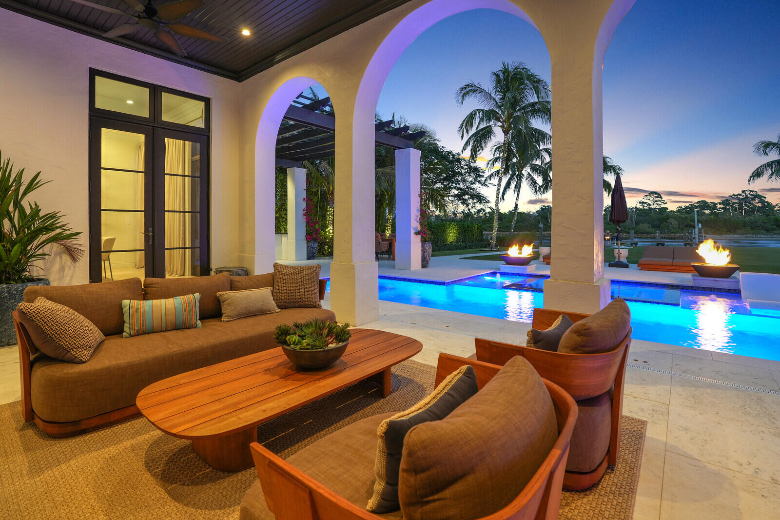 14140 Paradise Point Road Palm Beach Gardens, FL 33410 - Photo 130 of 148 a living room with furniture and garden view