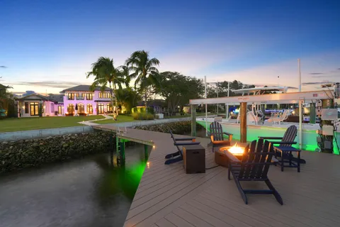 a front view of a house with a yard table and chairs