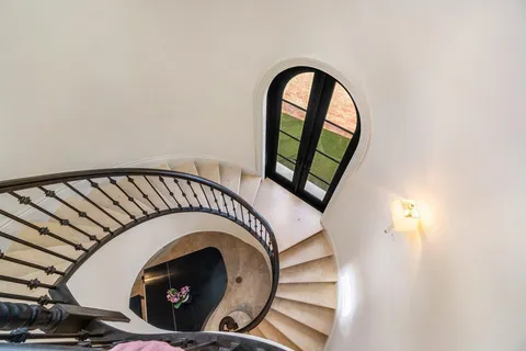 a view of a chairs and table in backyard