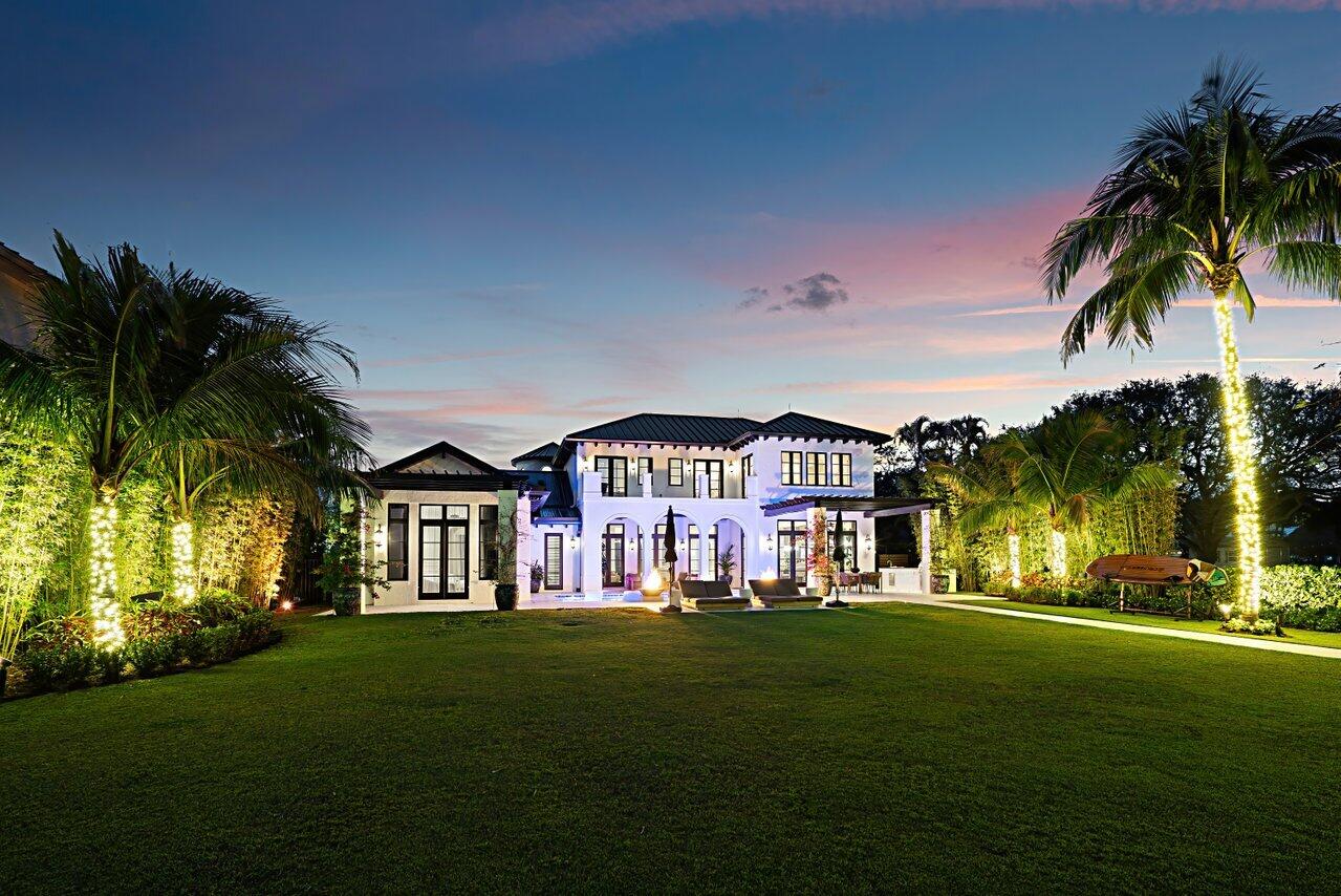 14140 Paradise Point Road Palm Beach Gardens, FL 33410 - Photo 69 of 148 a front view of a house with a garden