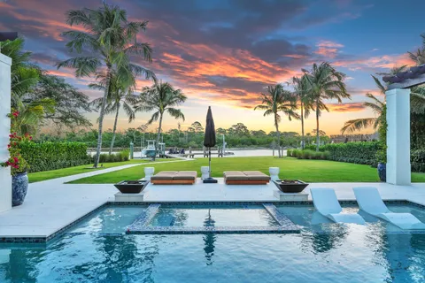 a bedroom with a large bed and a large window