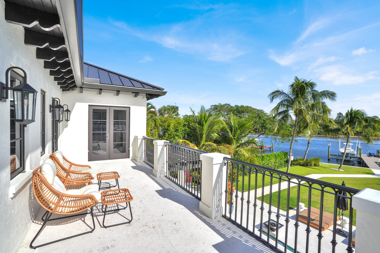 14140 Paradise Point Road Palm Beach Gardens, FL 33410 - Photo 71 of 148 a view of a chairs and table in patio with wooden fence