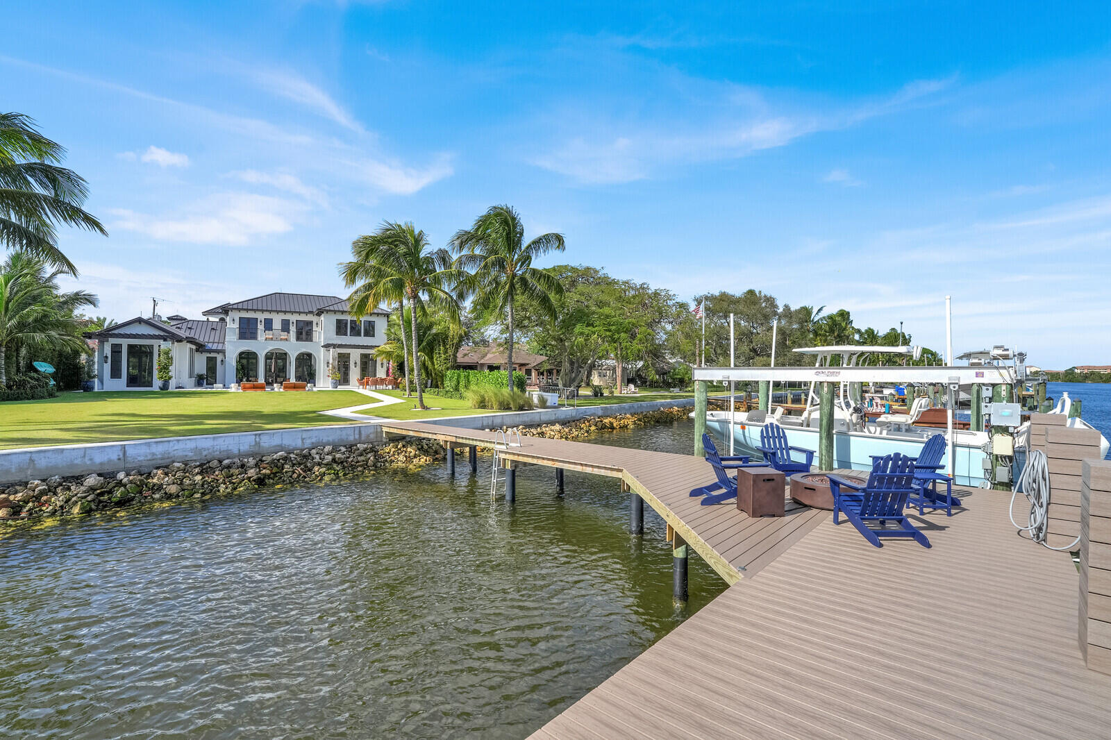 14140 Paradise Point Road Palm Beach Gardens, FL 33410 - Photo 84 of 148 a view of a swimming pool with a lounge chair