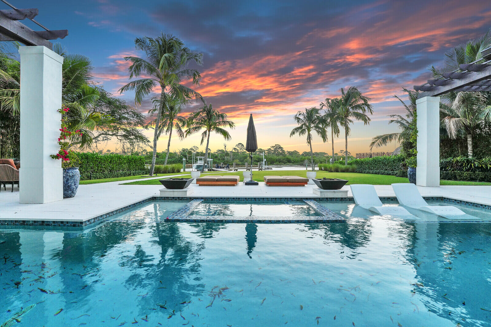 14140 Paradise Point Road Palm Beach Gardens, FL 33410 - Photo 92 of 148 a view of swimming pool with outdoor seating and plants