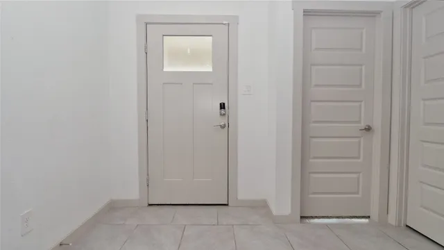 an empty room with closet area