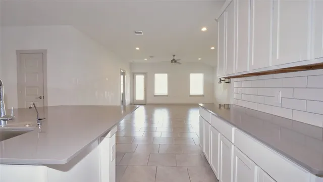 a bathroom with a sink and a large mirror