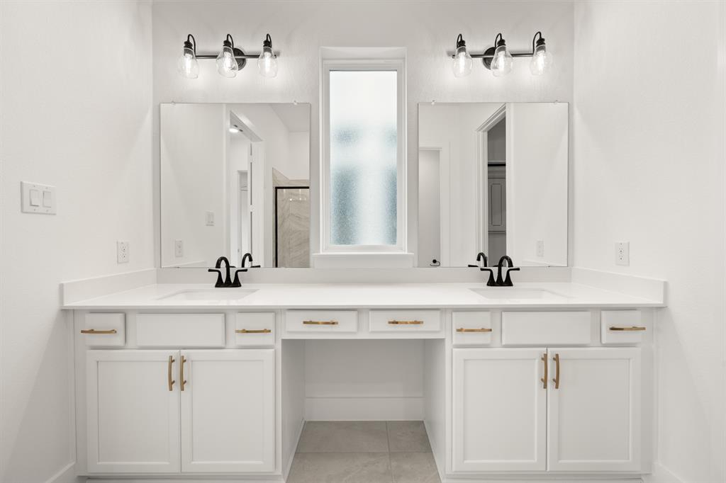 1725 Nesting Robin Lane Krum, TX 76249 - Photo 19 of 27 a bathroom with a sink vanity and mirror