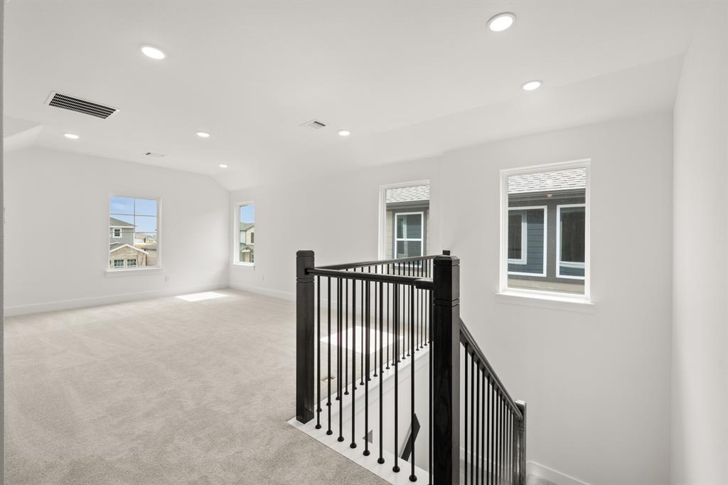 1725 Nesting Robin Lane Krum, TX 76249 - Photo 22 of 27 a view of a hallway with windows
