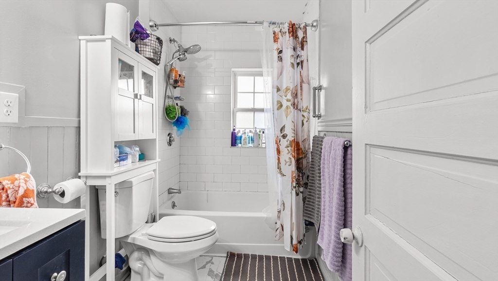 6 Crescent Street, Unit 6 Northbridge, MA 01588 - Photo 14 of 24 a bathroom with a sink toilet and shower