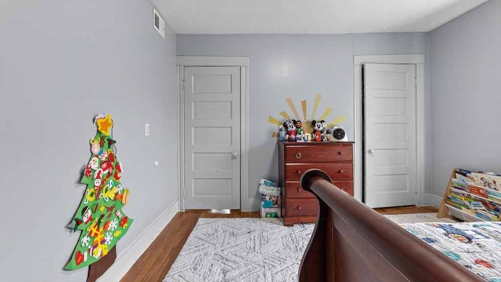 6 Crescent Street, Unit 6 Northbridge, MA 01588 - Photo 16 of 24 a bedroom with a bed and a dresser