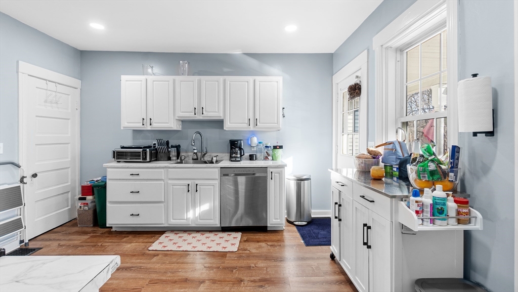 6 Crescent Street, Unit 6 Northbridge, MA 01588 - Photo 2 of 24 a kitchen with stainless steel appliances cabinets and a window