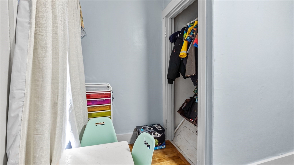 6 Crescent Street, Unit 6 Northbridge, MA 01588 - Photo 21 of 24 a view of walk in closet with clothes and shoes