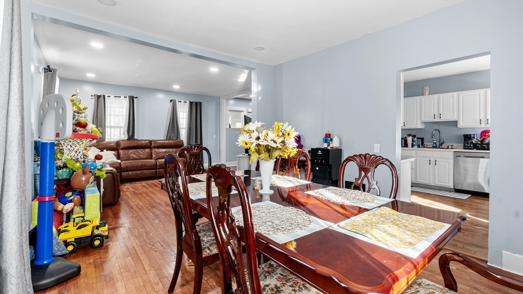 6 Crescent Street, Unit 6 Northbridge, MA 01588 - Photo 9 of 24 a view of a dining room with furniture and a chandelier