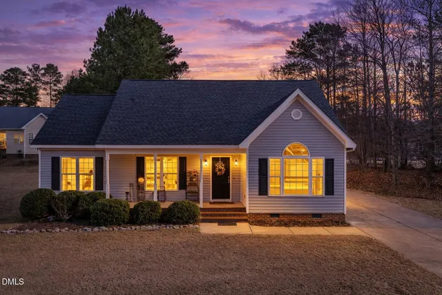 a front view of a house with yard