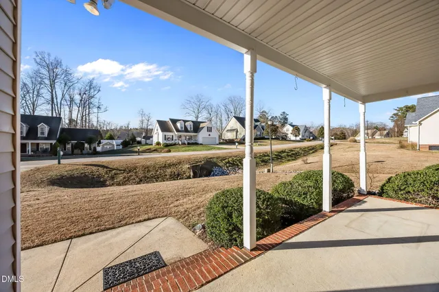 a view of a room with wooden floor and small cabinets