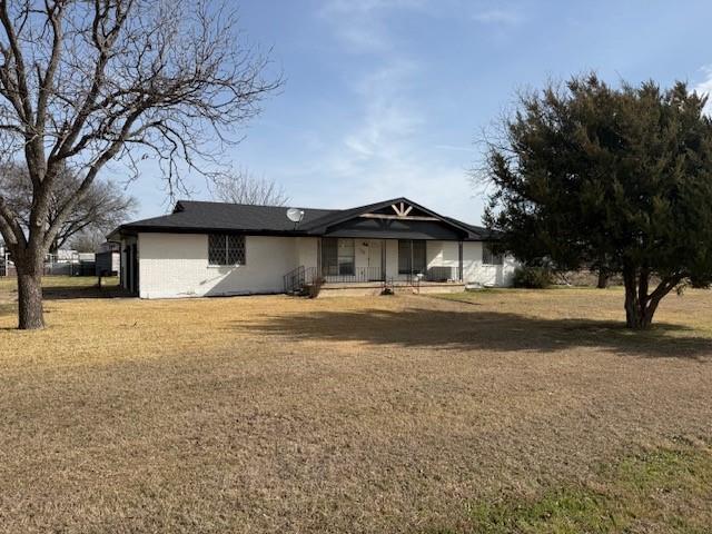 112 Big Bass Road West, TX 76691 - Photo 1 of 21 Ranch-style home featuring covered porch and a front yard