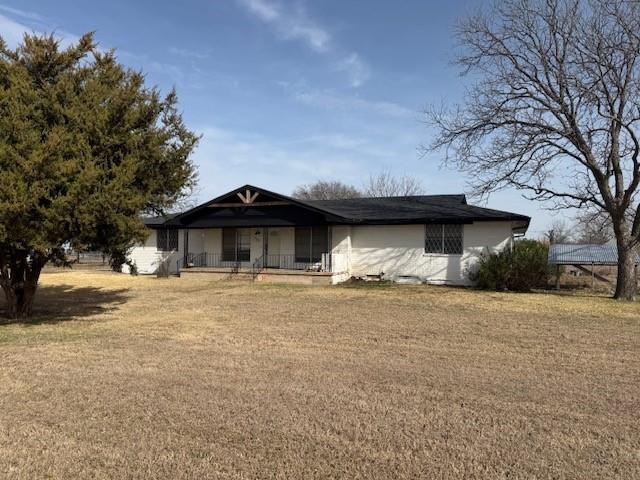 112 Big Bass Road West, TX 76691 - Photo 2 of 21 View of front of house featuring a porch and a front yard
