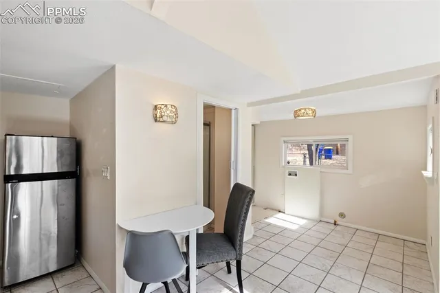 a view of kitchen with furniture and wooden floor