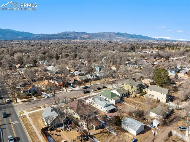 an aerial view of residential house and green space