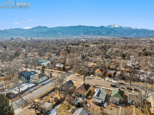 an aerial view of residential house and mountain view