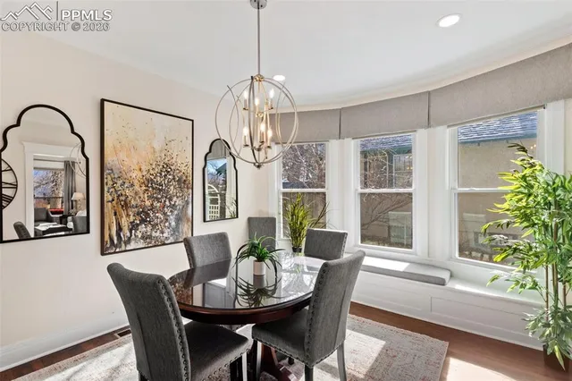a view of a dining room with furniture window and wooden floor